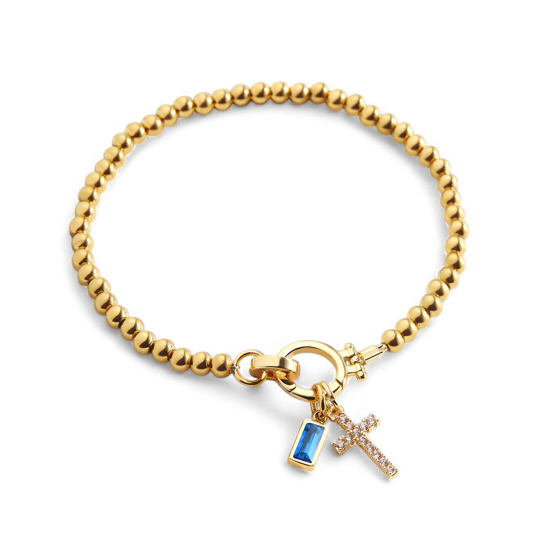 Bracciale con ciondolo a croce e pietra portafortuna