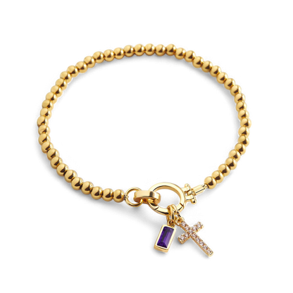 Bracciale con ciondolo a croce e pietra portafortuna