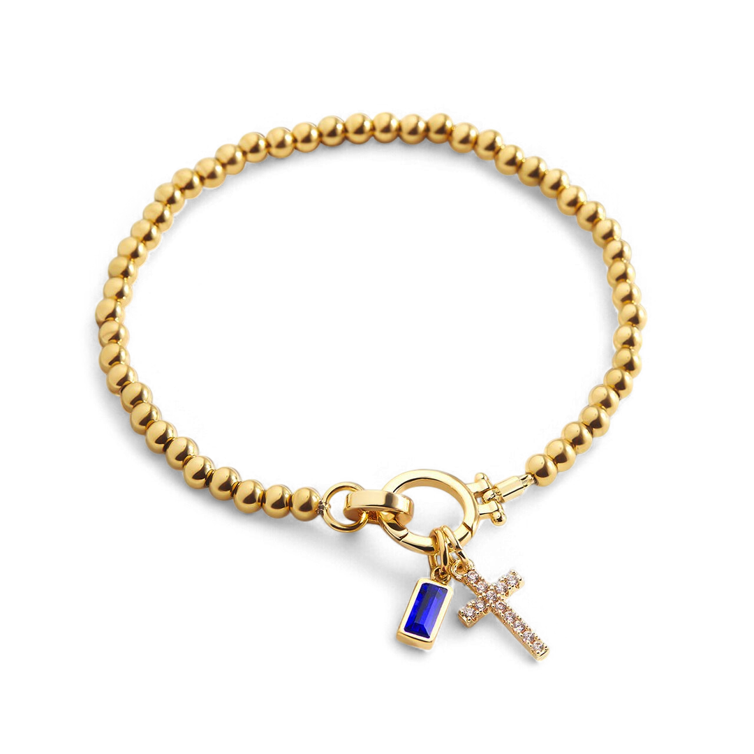 Bracciale con ciondolo a croce e pietra portafortuna