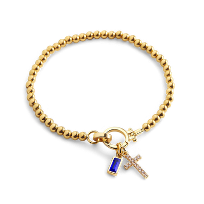 Bracciale con ciondolo a croce e pietra portafortuna