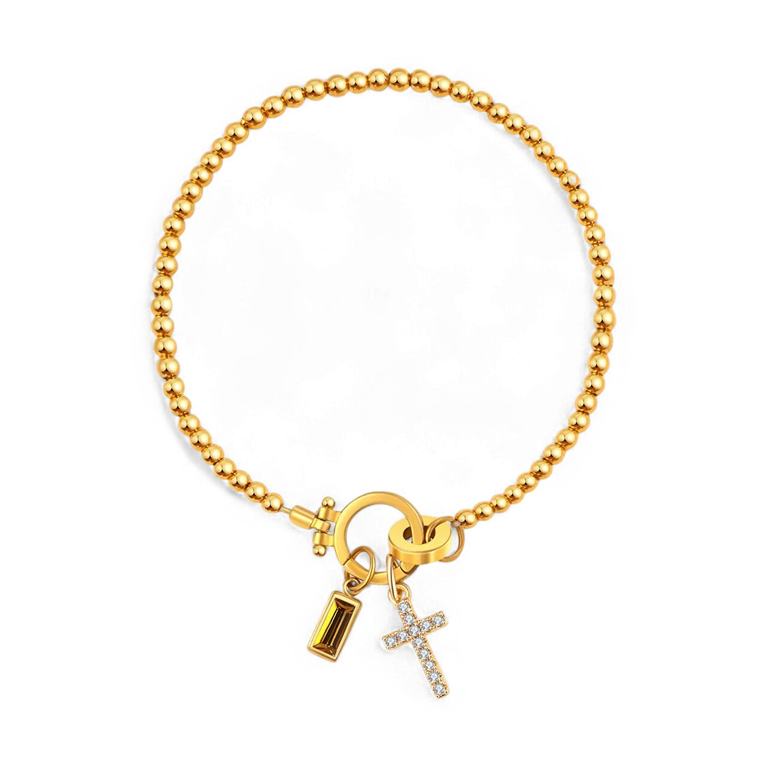 Bracciale con ciondolo a croce e pietra portafortuna