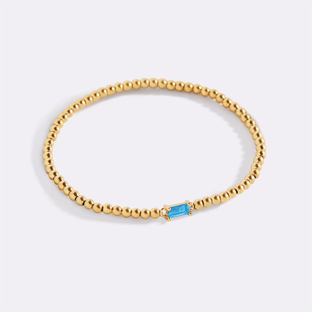 Bracelet of gold beads with birth stone