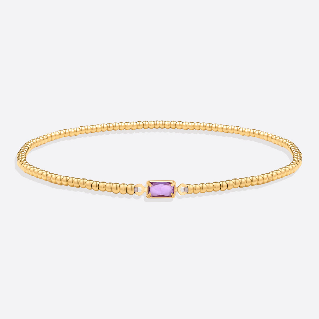 Bracelet of gold beads with birth stone